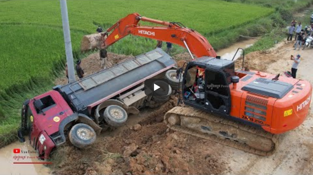 Rescuing a dump truck that fell into a water canal cover